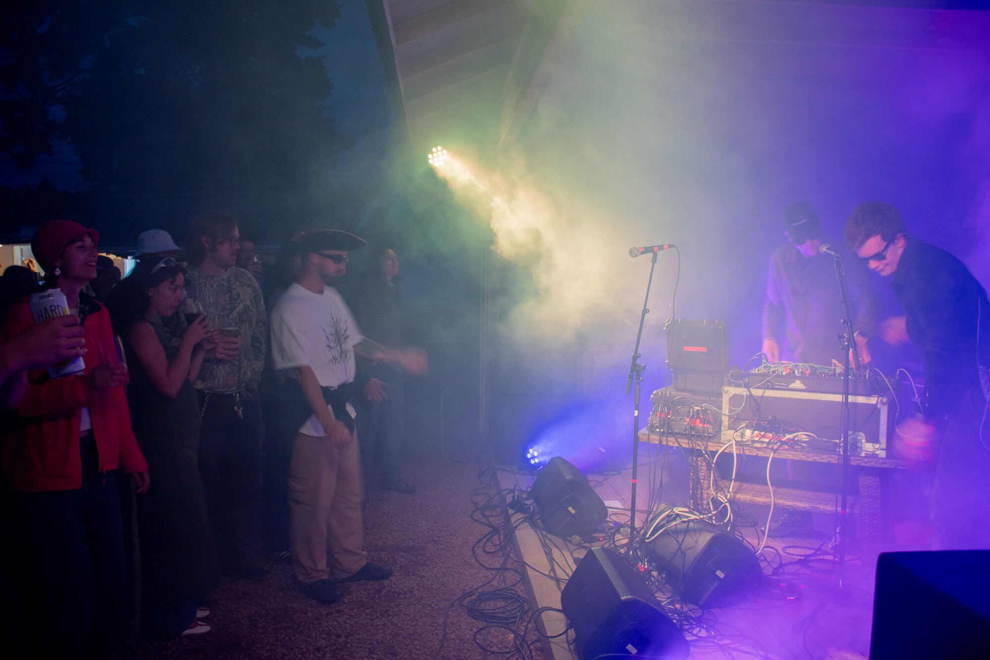 Friendship 7 on stage in blue light and smoke, the audience in front