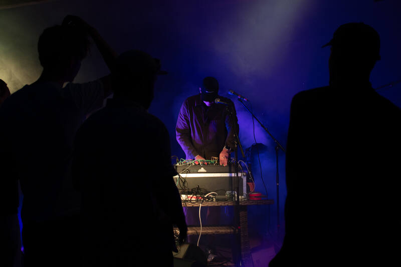 Silhouettes of the audience in front of the stage